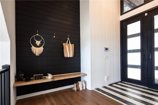 mudroom with a wealth of natural light, french doors, and wood-type flooring