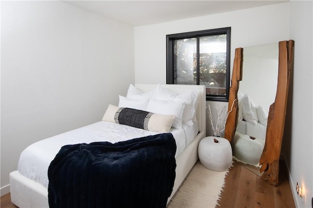 bedroom featuring wood-type flooring