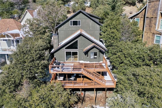 back of property featuring a deck