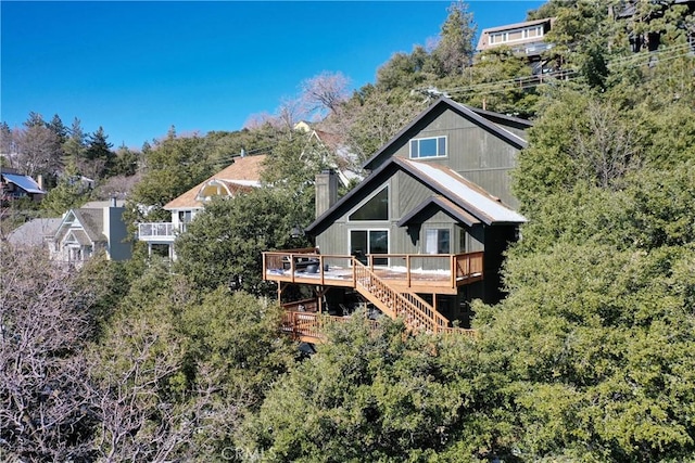 rear view of house with a wooden deck