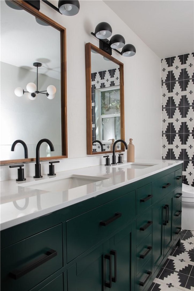 bathroom with vanity, tile patterned floors, and toilet