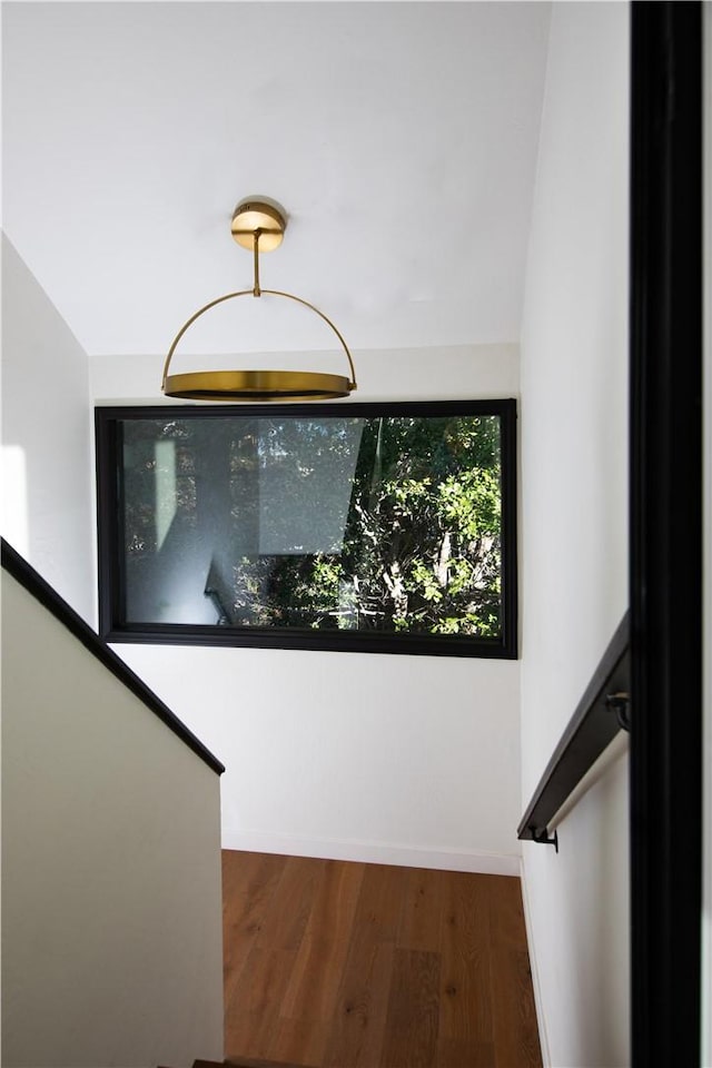 stairway featuring hardwood / wood-style flooring