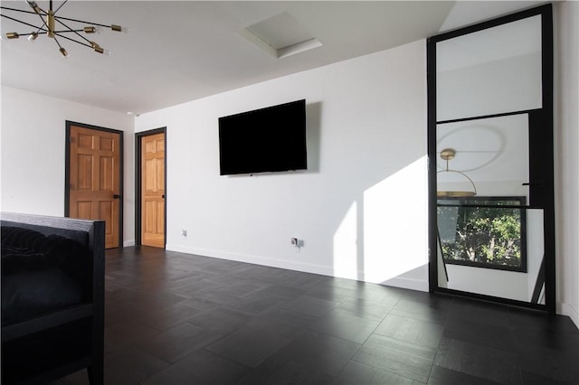 unfurnished living room featuring an inviting chandelier