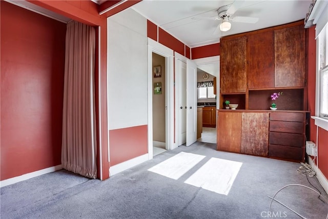 kitchen with light carpet and ceiling fan