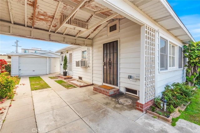 view of exterior entry with a patio and cooling unit