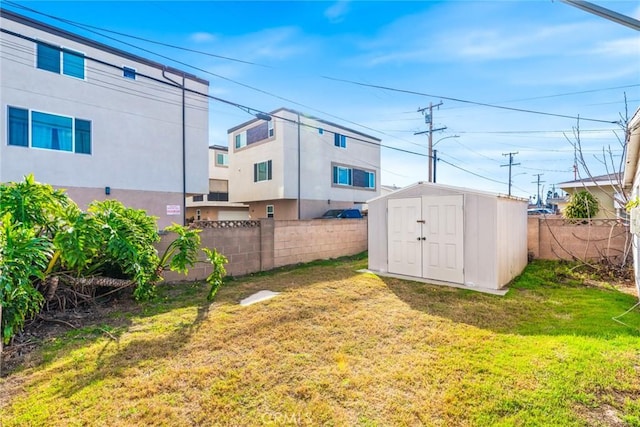 view of yard with a storage unit