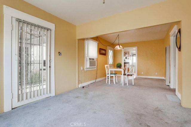 unfurnished dining area with carpet floors