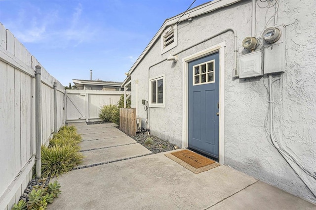 doorway to property with a patio area