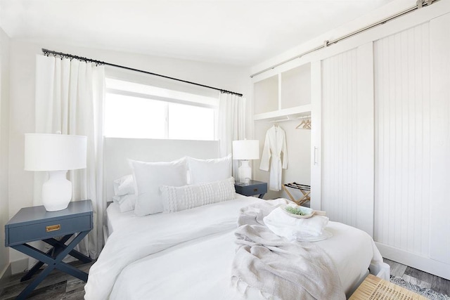 bedroom featuring hardwood / wood-style flooring and a closet