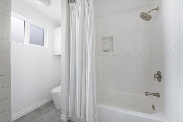 bathroom featuring shower / bathtub combination with curtain and toilet