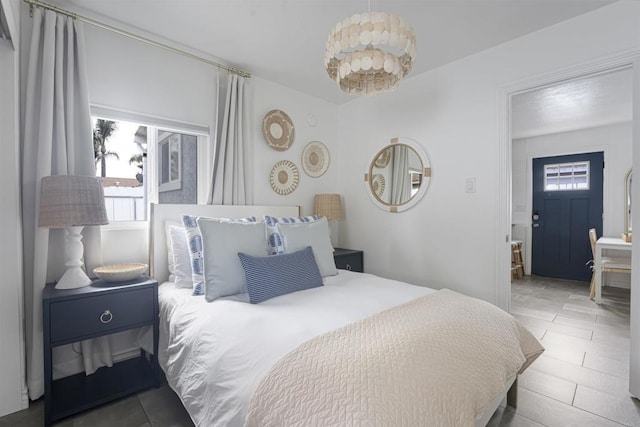 bedroom featuring tile patterned flooring and multiple windows