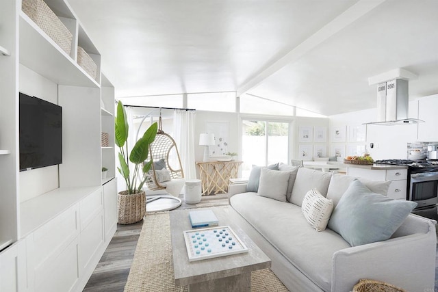 living room featuring dark wood-type flooring and lofted ceiling with beams