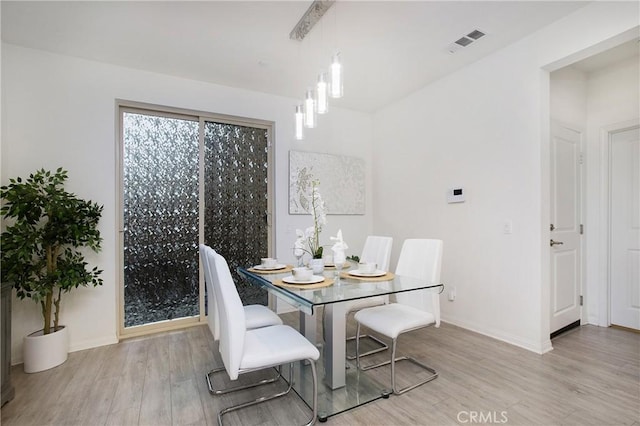 dining room featuring light wood-type flooring