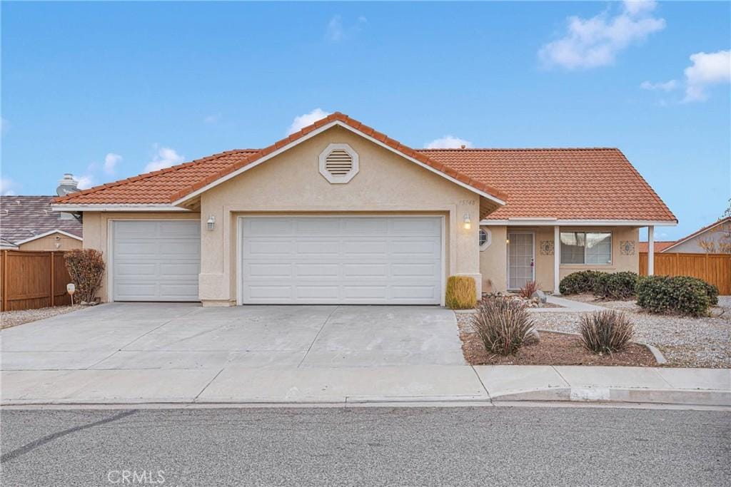 single story home featuring a garage