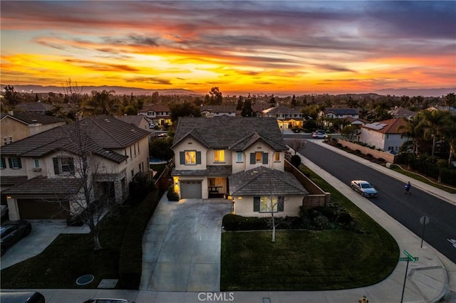 aerial view at dusk with a residential view