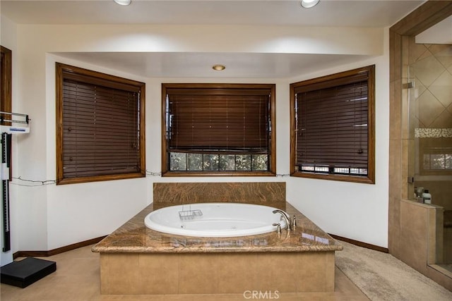 bathroom with shower with separate bathtub