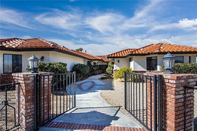 view of front of home featuring fence