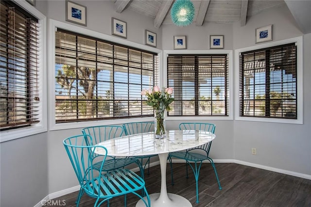 dining space with wooden ceiling and lofted ceiling with beams