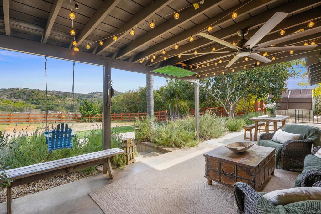 view of patio featuring ceiling fan