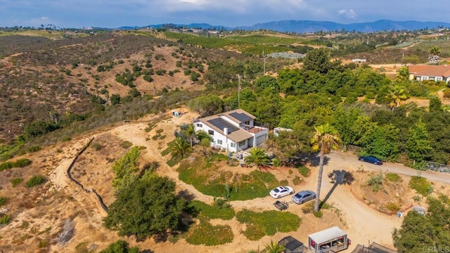 drone / aerial view featuring a mountain view