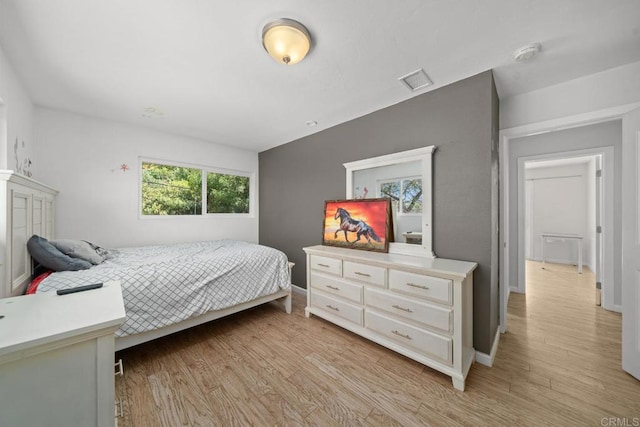 bedroom with light wood-type flooring
