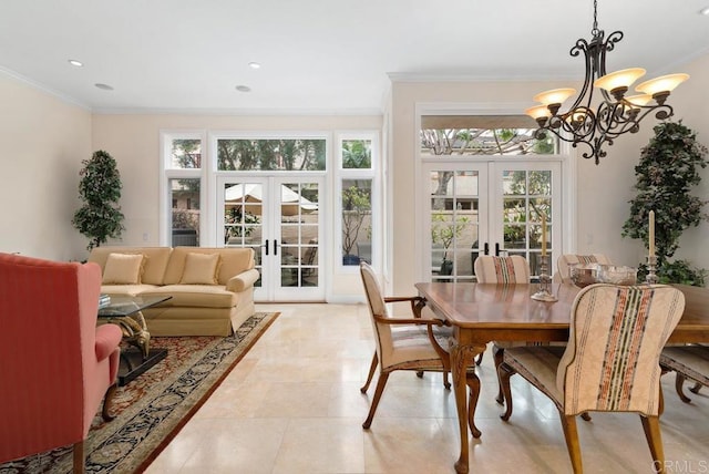 sunroom / solarium featuring a healthy amount of sunlight and french doors