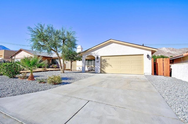 ranch-style house featuring a garage