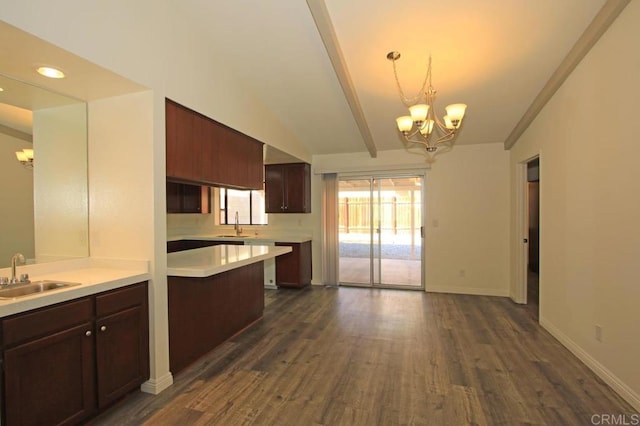 kitchen with pendant lighting, vaulted ceiling with beams, sink, dark hardwood / wood-style flooring, and an inviting chandelier