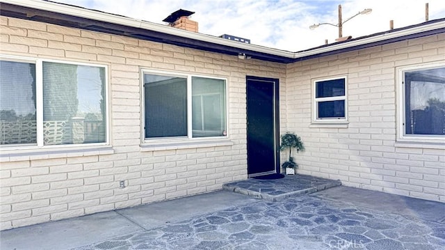 property entrance with a patio