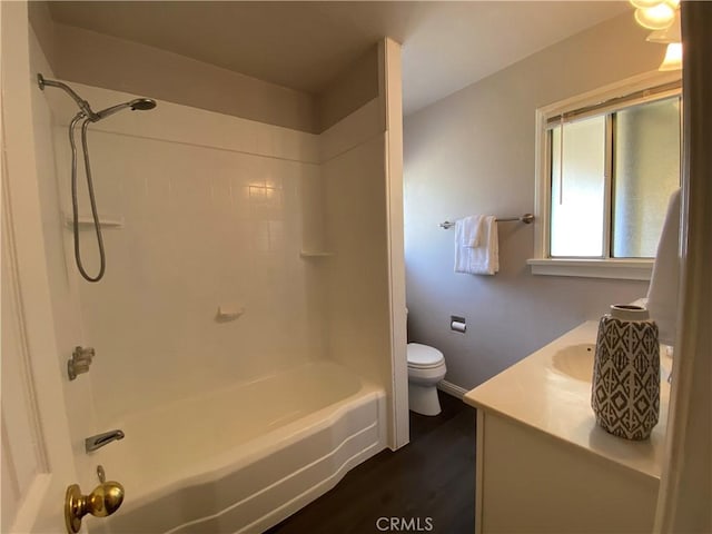 full bathroom with vanity, wood-type flooring, shower / washtub combination, and toilet