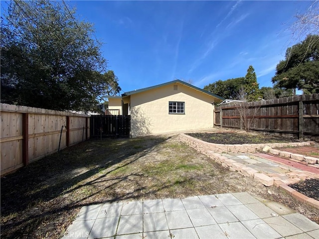 back of property with a patio