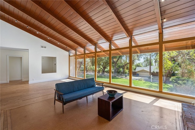 unfurnished sunroom with vaulted ceiling and wood ceiling