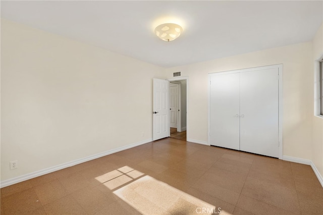 unfurnished bedroom featuring a closet