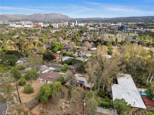 birds eye view of property with a mountain view