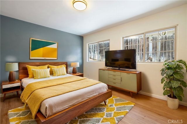 bedroom with light wood-type flooring