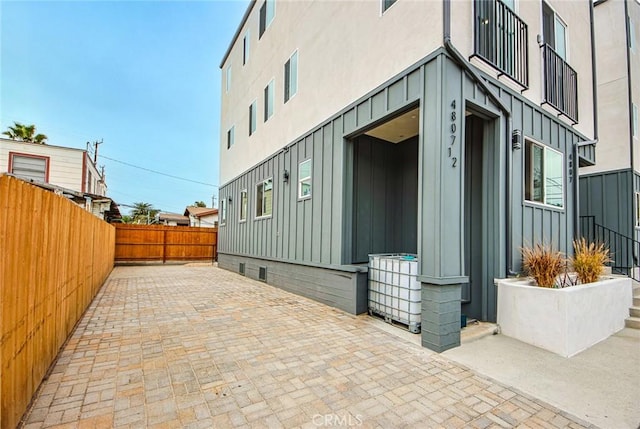 view of side of home featuring a patio area