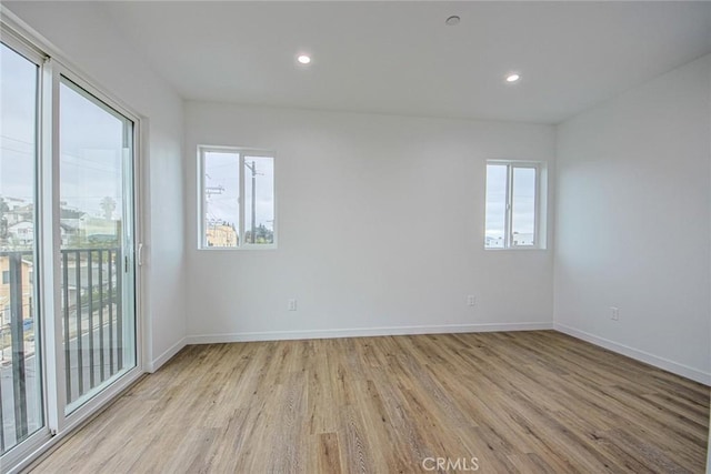 unfurnished room featuring light hardwood / wood-style flooring