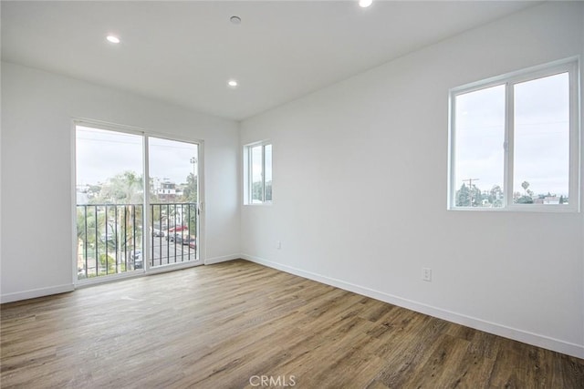 unfurnished room featuring light hardwood / wood-style floors