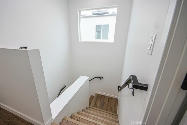 staircase featuring hardwood / wood-style flooring