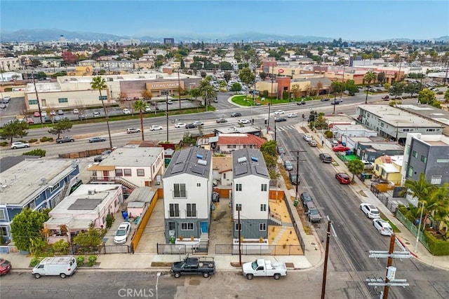 birds eye view of property with a mountain view