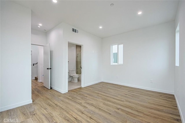 spare room with light hardwood / wood-style floors