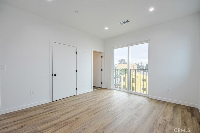 empty room featuring light hardwood / wood-style floors