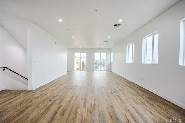 unfurnished living room with light hardwood / wood-style floors