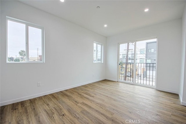 spare room featuring light hardwood / wood-style flooring