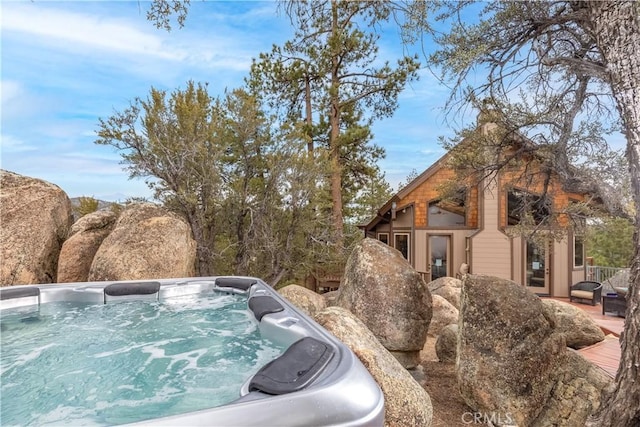 exterior space featuring a jacuzzi