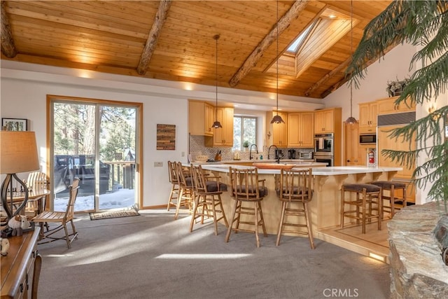 42848 Eagle Flight Pl, Big Bear Lake, CA 92315 - kitchen featuring light brown cabinetry, a skylight, decorative backsplash, hanging light fixtures, and wood ceiling