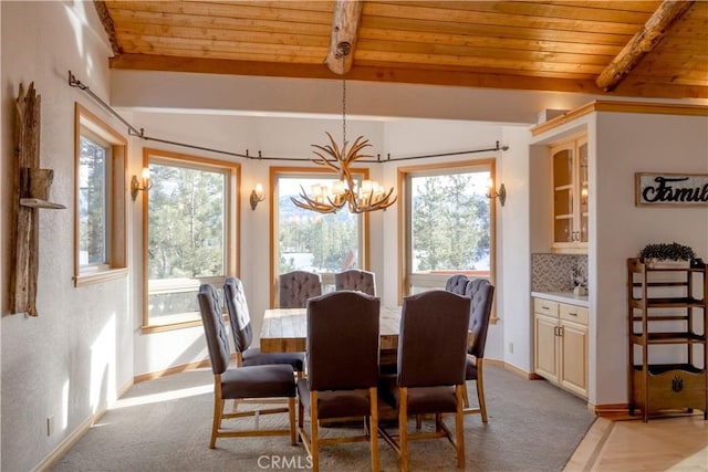 42848 Eagle Flight Pl, Big Bear Lake, CA 92315 - dining space with light colored carpet, lofted ceiling with beams, wooden ceiling, and a chandelier