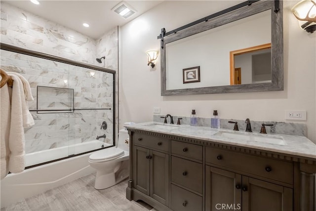 42848 Eagle Flight Pl, Big Bear Lake, CA 92315 - full bathroom featuring vanity, hardwood / wood-style floors, enclosed tub / shower combo, and toilet