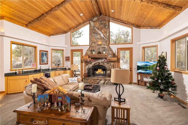 42848 Eagle Flight Pl, Big Bear Lake, CA 92315 - living room featuring high vaulted ceiling, a fireplace, light colored carpet, and wooden ceiling