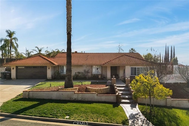 view of front of home featuring a front yard and a garage